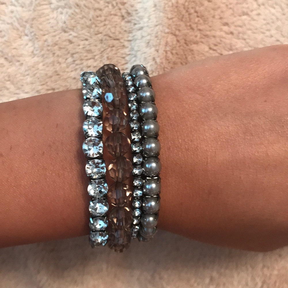 Gray and black stack of bracelets